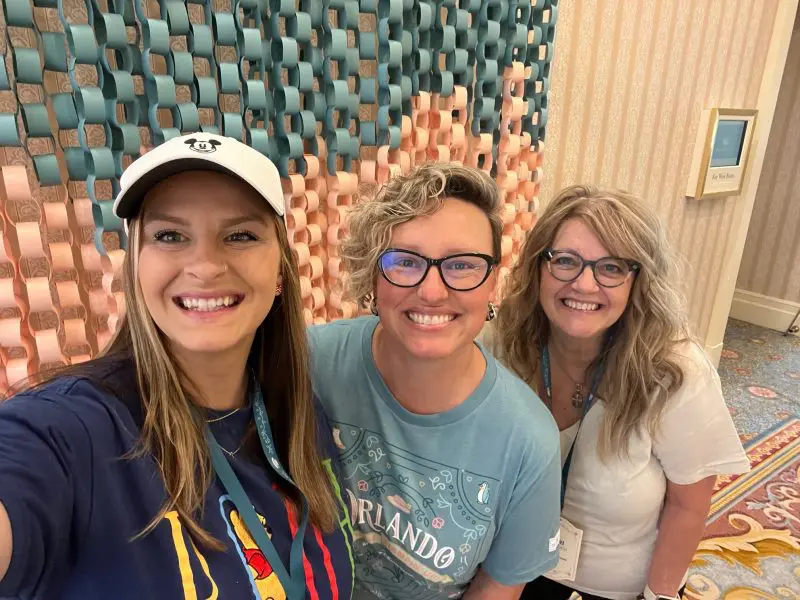 Three people smiling for a selfie