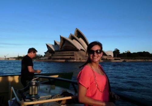 Woman smiling near Sydney Opera House